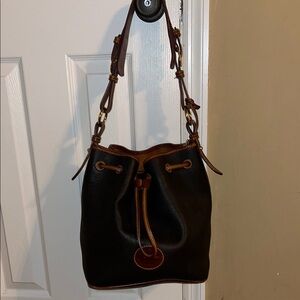 Elegant Dooney and Bourke Black and Brown Leather Bucket Bag